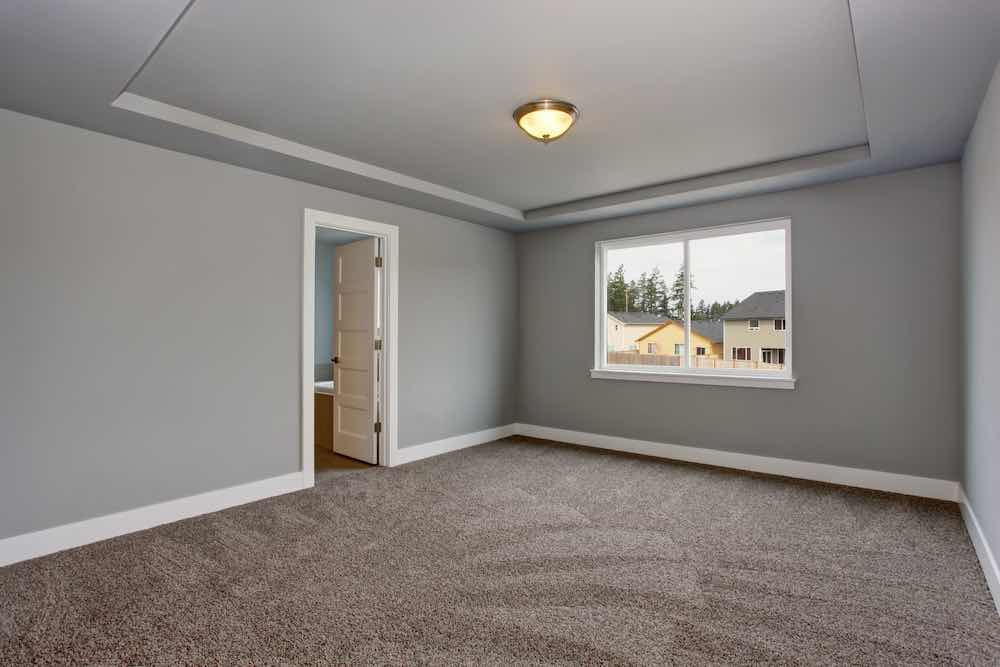 Grey Basement Room With Painted Trim