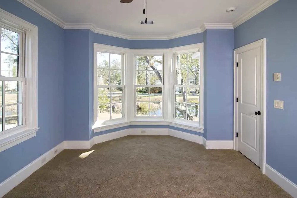 Paint and Primer in One: What It Is and When to Use It 4 Blue Sunroom With Painted Trim