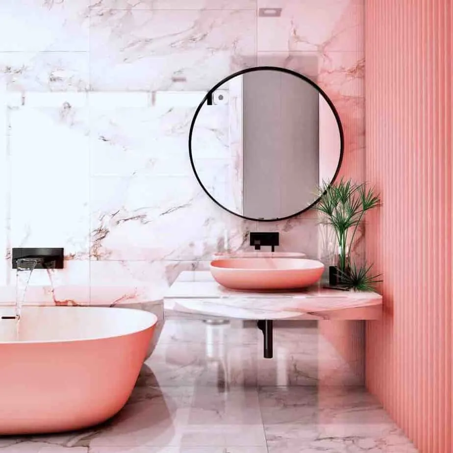 22 Inspiring Bathroom Paint Colors 4 A stylish bathroom with pink wall, sink, and tub and pink marble tiling.