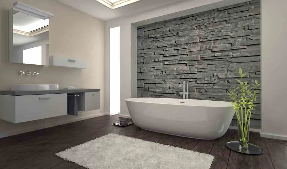 22 Inspiring Bathroom Paint Colors 2 A modern bathroom with pale beige walls and natural stone tiling.