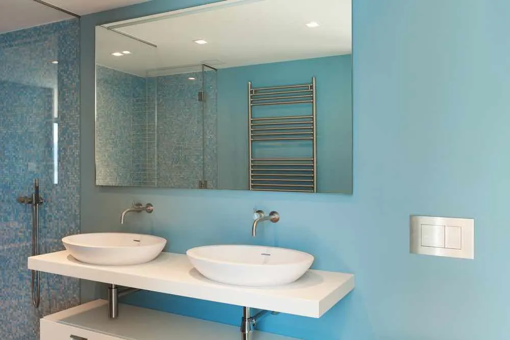 22 Inspiring Bathroom Paint Colors 18 His and hers sinks set on a white vanity with robin's egg blue painted walls.