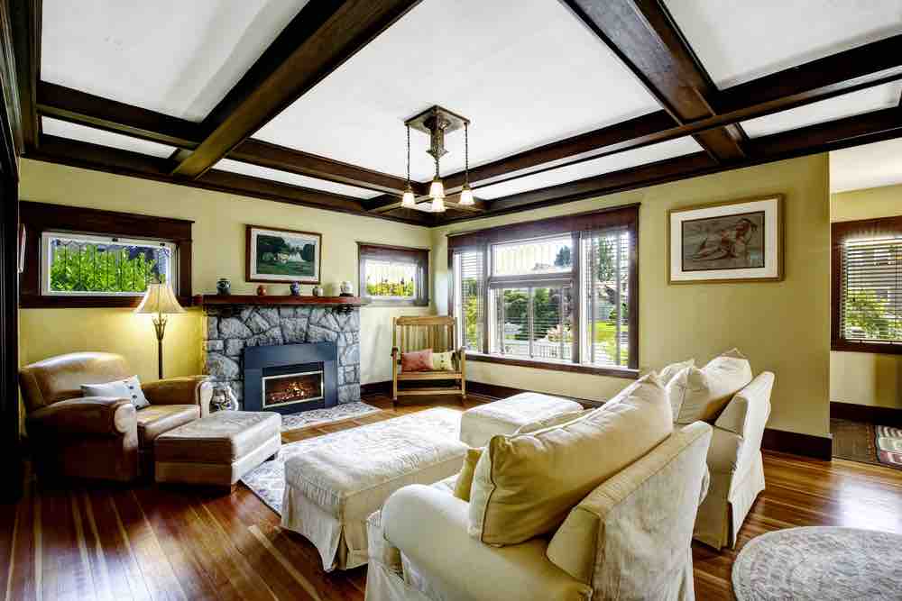 Olive green is one of the best living room paint colors because it looks great in tough-to-style rooms. 
