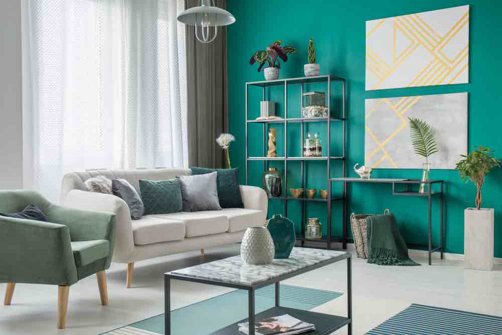 Bold turquoise makes one of the best living room paint colors because it's intense without making a room look dark. 