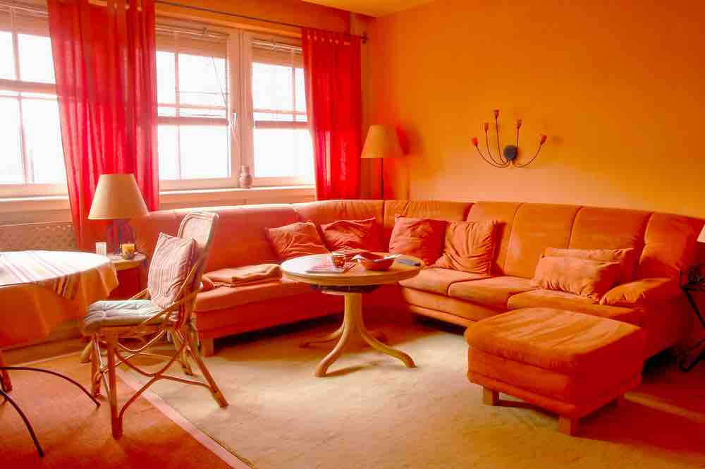 We can't wait to see more orange on living room walls, one of the best living room paint colors of all time. 