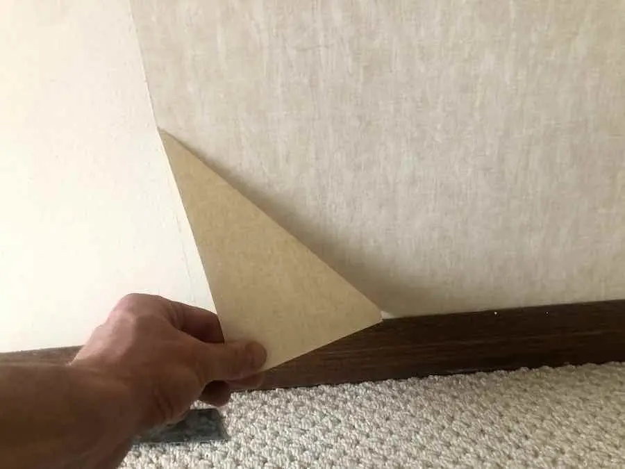 How To Remove Wallpaper 14 Pulling off the top layer of wallpaper.