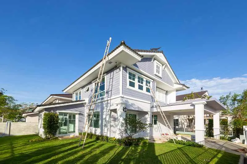 How Much Does It Cost To Paint a House? A Detailed Breakdown Of House Painting Costs 1 Exterior House Getting Painted