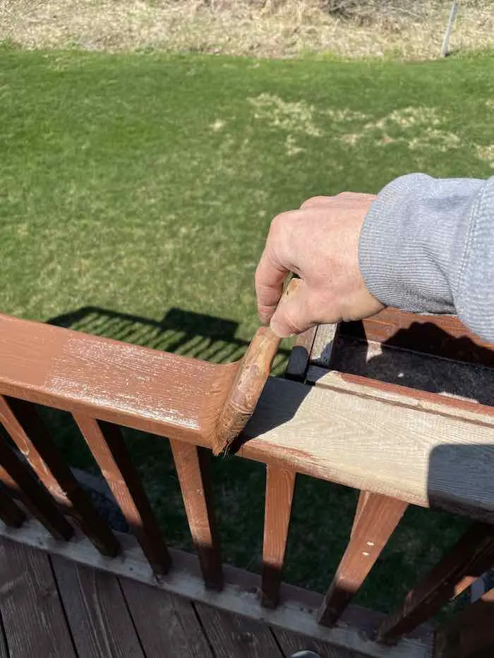 How To Use and Apply Behr Deck Stain: A Complete Review & Users Guide 3 Ryan Staining A Deck Rail