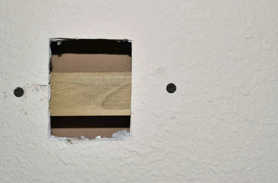 Drywall Thickness Guide: What to Use and Where 5 cutting a hole in drywall to measure thickness