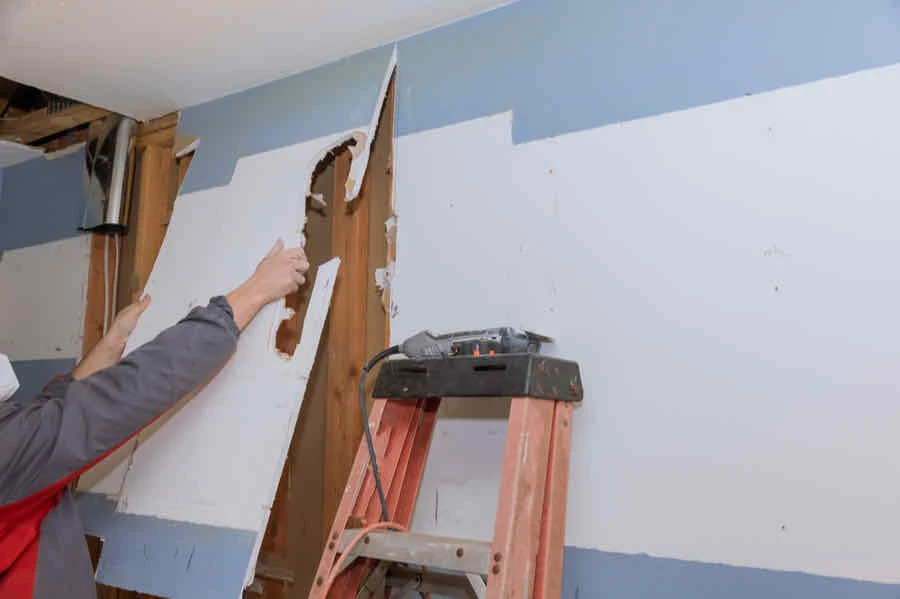 How to Remove Drywall Quickly, Easily, and Mess Free 2 drywall removal in process