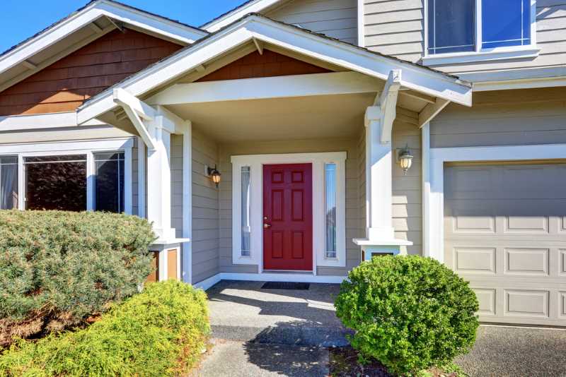 Gray exterior with a bright red front door