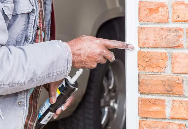 The Best Caulking For Outdoors in 2023 7 using the best exterior caulk to caulk around a door