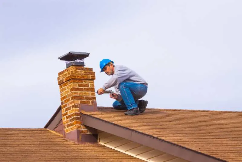 The Best Caulking For Outdoors in 2023 8 Applying durable caulk to a chimney
