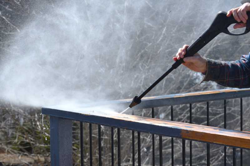 Stripping paint from wood with a pressure washer