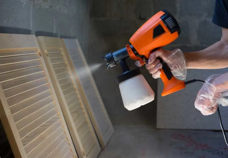 A Complete Buyers Guide for the 9 Best HVLP Paint Sprayers 3 Using a paint sprayer to paint shutters