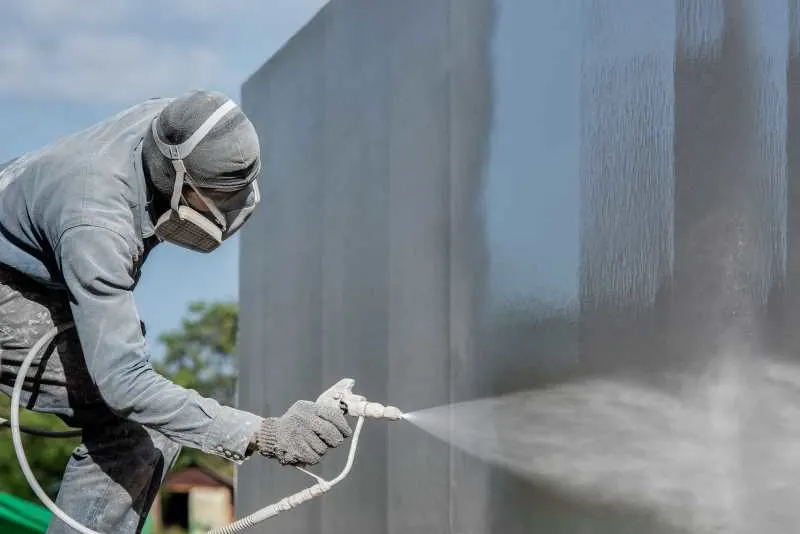 Best Paint Sprayer for Exterior House Painting Projects: My Top 8 Picks 2 Painting an exterior with a paint sprayer