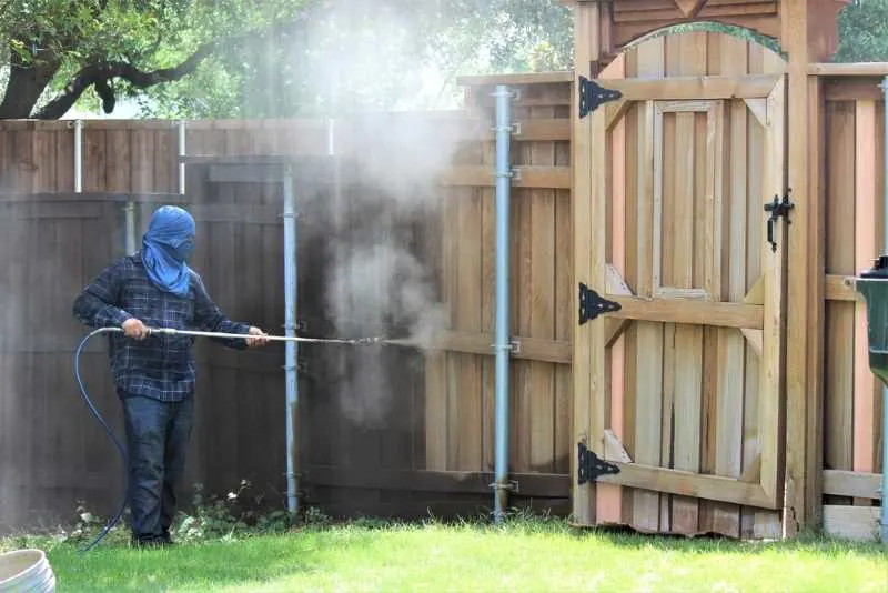 How to Paint a Fence with a Sprayer 3 Cleaning a Fence with a Power Washer