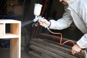 Using the best paint sprayer for furniture to paint a desk