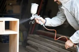 Using the best paint sprayer for furniture to paint a desk