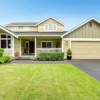 A house painted with multiple green exterior paint colors