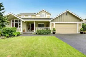 A house painted with multiple green exterior paint colors