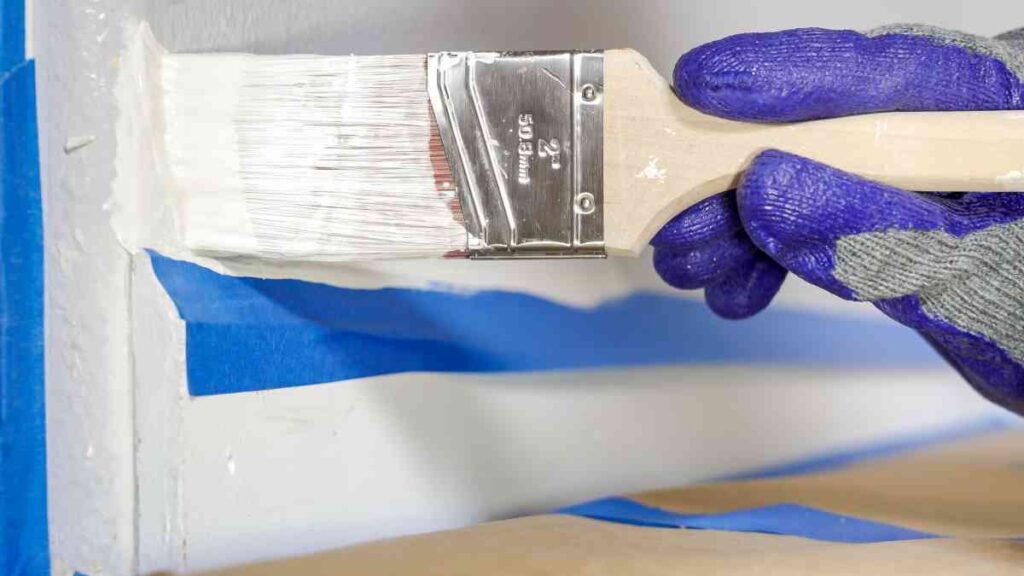 Using the best paint brush for cutting in to paint around molding