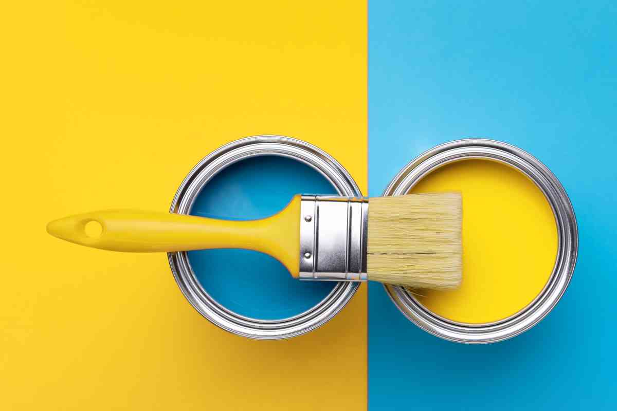 blue and yellow paint cans with paint brush indicating satin vs semi gloss sheens