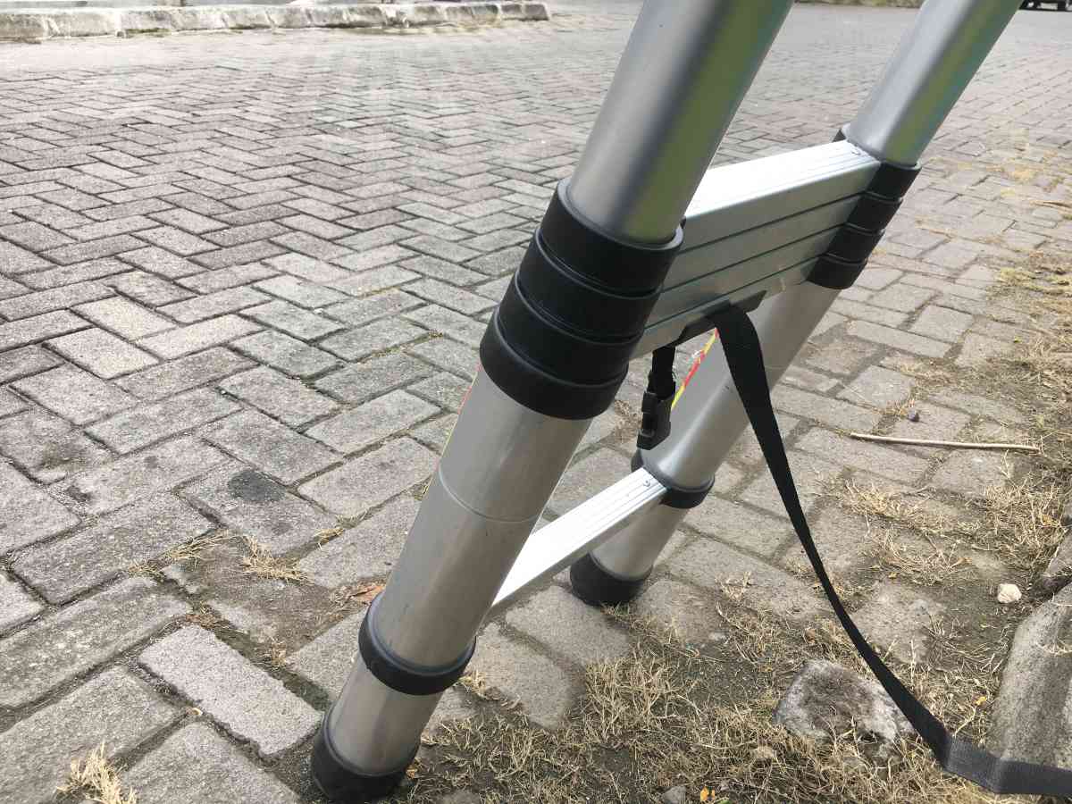 The best telescoping ladder on a brick patio