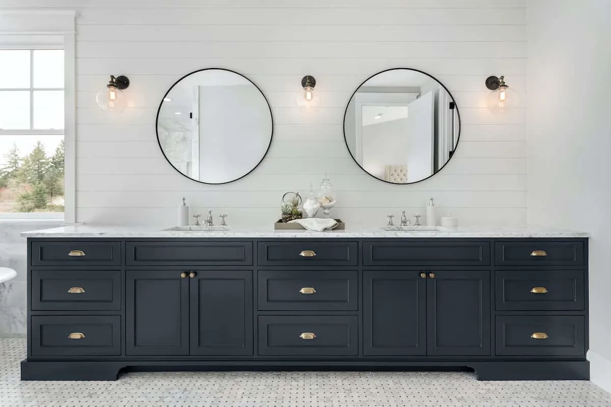 Bathroom vanity cabinets painted dark blue.