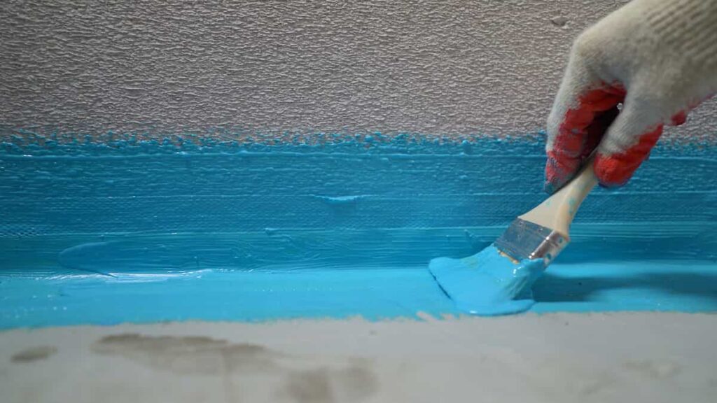 How to Paint Concrete: A Beginner's Guide 1 Painting concrete and stucco with blue paint. Before starting, know how to paint concrete for the best results.