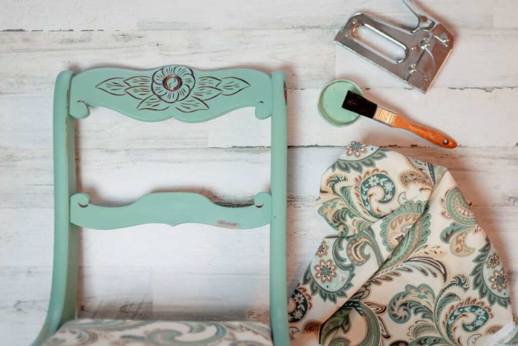 A vintage chair and light blue-green chalk paint. Learn how to chalk paint furniture.