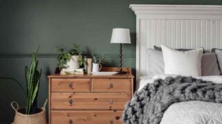 White bed with grey and natural wood accents. A green wall for bedroom paint ideas