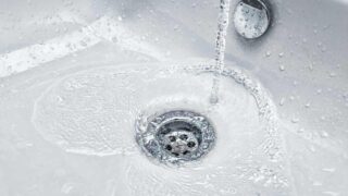 Water flowing into a bathroom sink drain