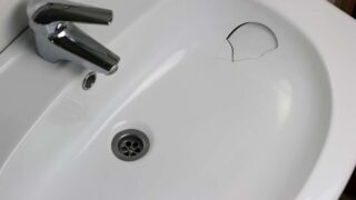 Bathroom sink with a hole in it. Replacing a bathroom sink