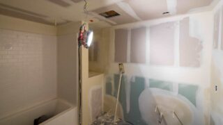 DIY bathroom remodel replacing drywall, sink, and vanity