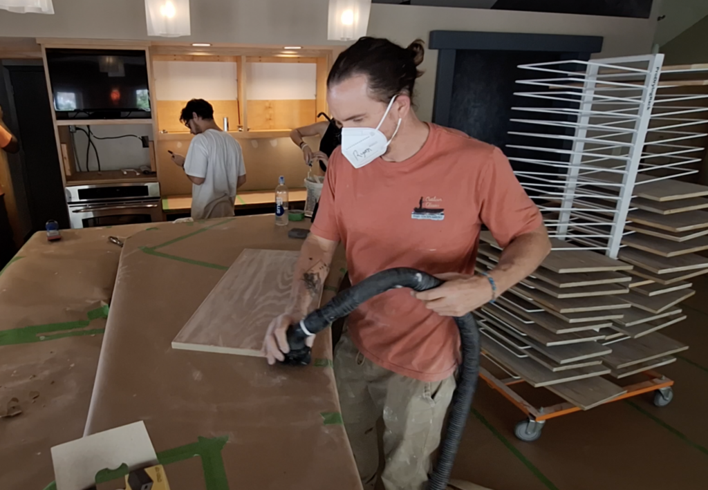 Ryan vacuuming cabinet doors