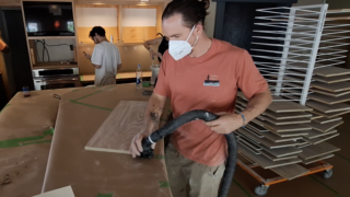 Ryan vacuuming cabinet doors